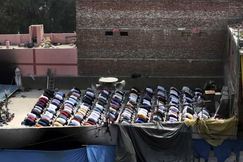 ”If they burn our mosques, we will rebuild them”: Prayers at fire-bombed mosques as India’s riot toll grows